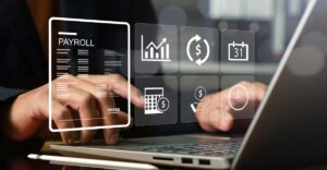 Person using a laptop with digital payroll and compensation icons representing key objectives of compensation management.