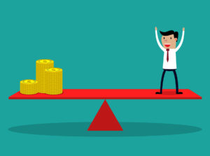 Businessman and golden coins on balancing beam scale