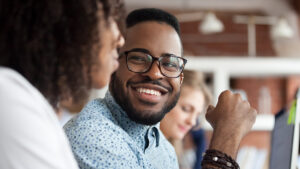 Diverse businesspeople smiling and meeting\