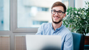 Young businessman smiling at camera