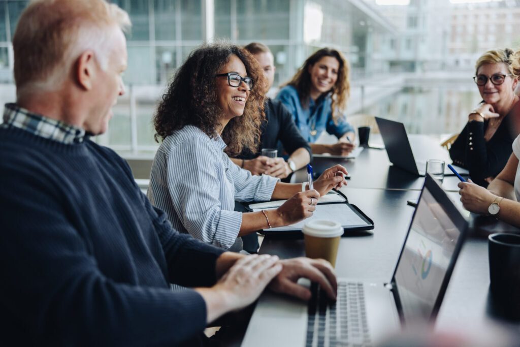 HR Managers during a Compensation strategy meeting in conference room.